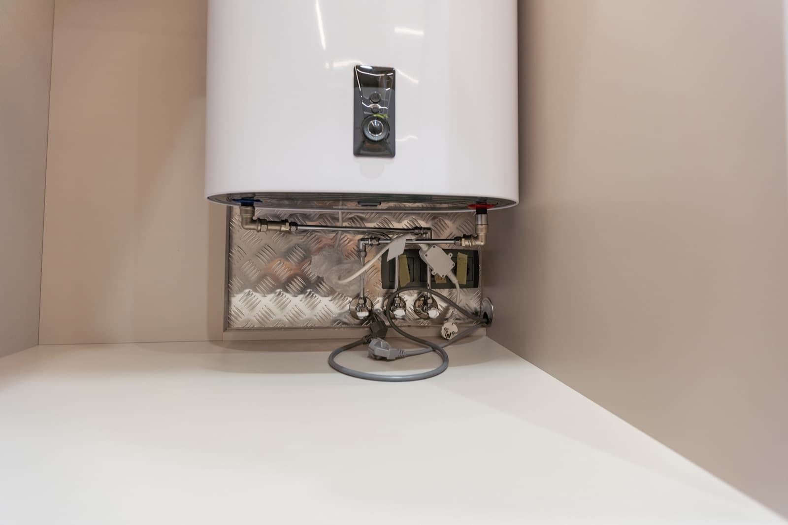 Modern wall-mounted water heater installed in a home